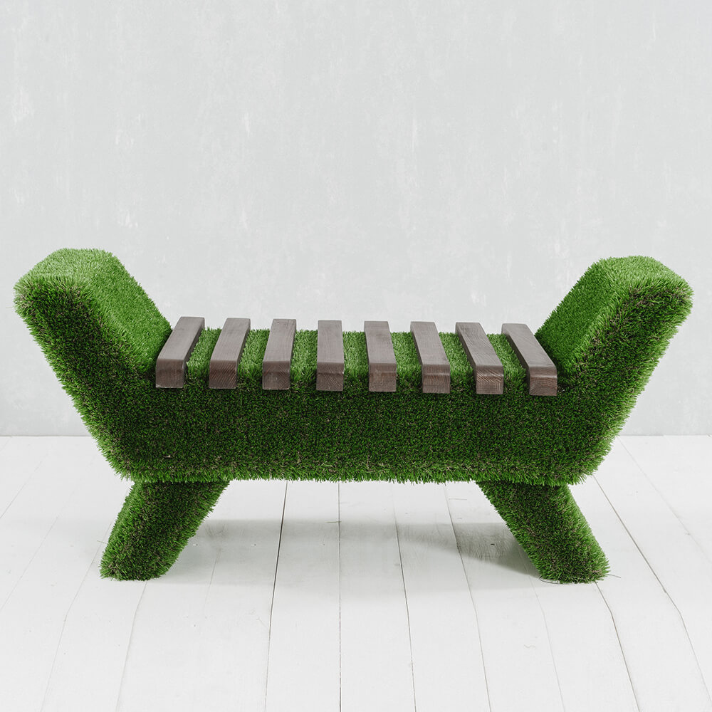 Banc de jardin vert avec assise en lattes de bois et cadre recouvert de gazon