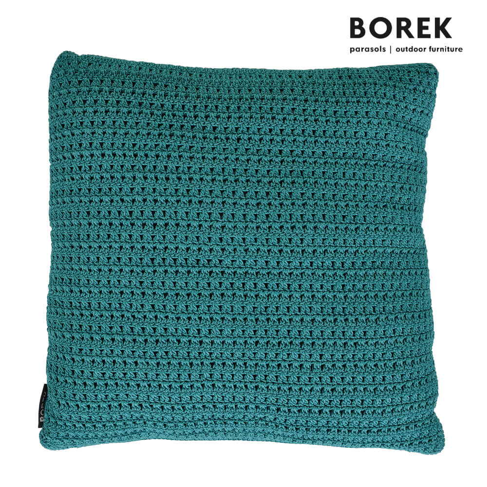 Grünes gestricktes Kissen für den Gartenbereich