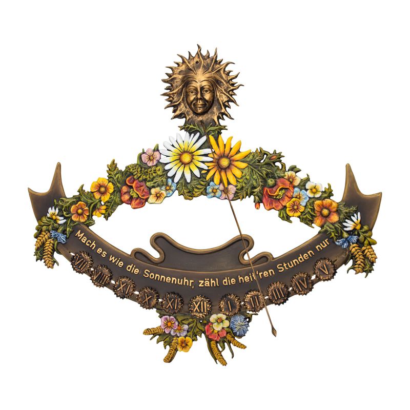 Un cadran solaire décoratif avec des fleurs colorées et un motif de soleil en haut