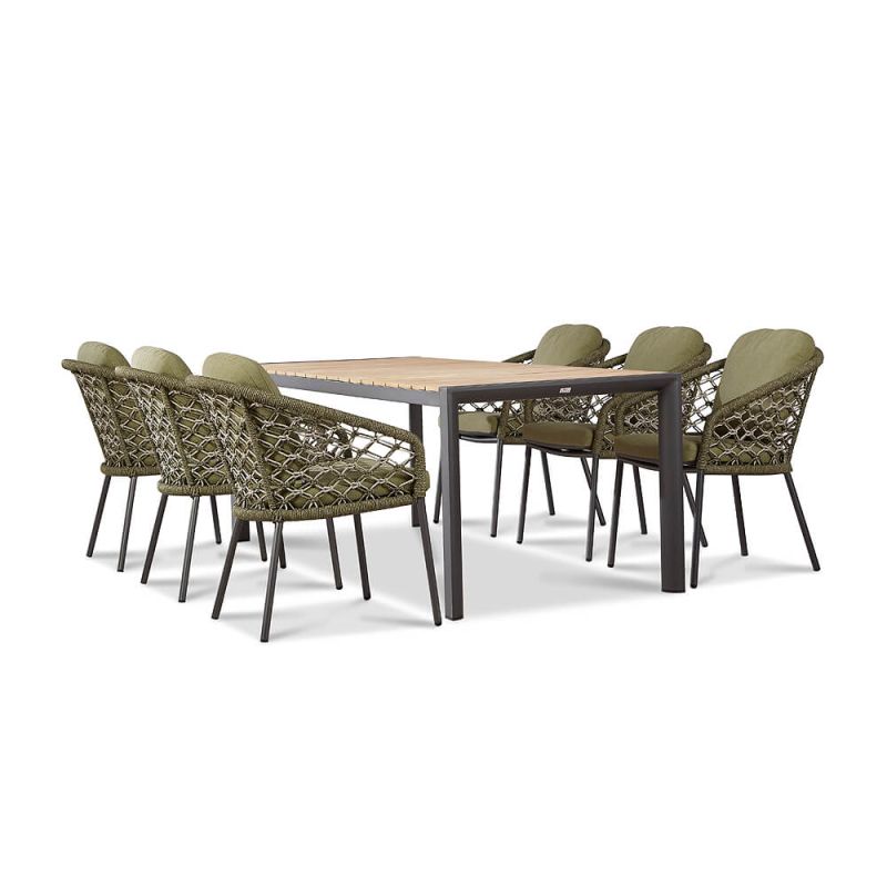 Elegante tavolo da giardino con sei sedie intrecciate e cuscini verdi