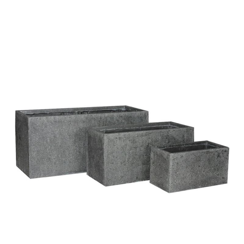 Trois jardinières rectangulaires grises en béton de tailles différentes pour le jardin
